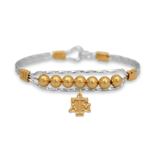 Texas A&M two-tone beaded bracelet with gold beads and ATM logo charm. Texas A&M two-tone beaded bracelet with gold beads and ATM logo charm.