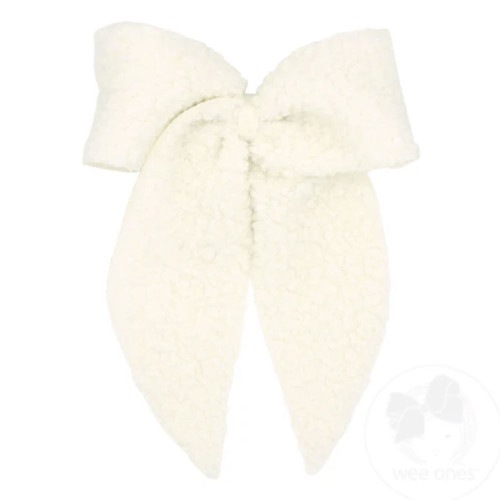Soft ivory plush oversized hair bow with a cozy textured finish.