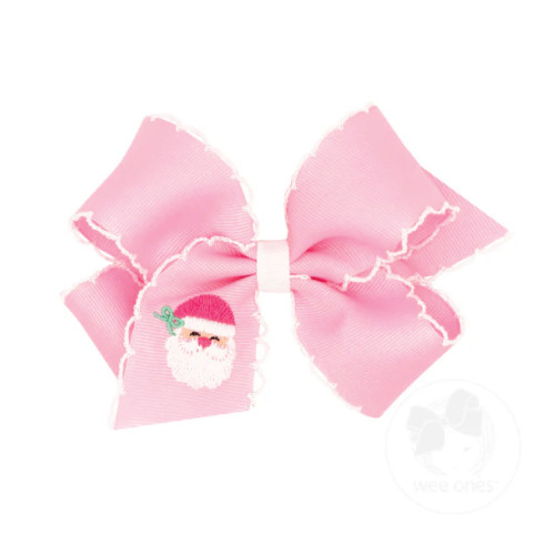 Light pink Christmas hair bow with embroidered Santa detail and scalloped edges.