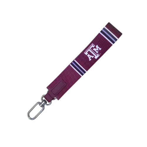 Maroon Texas A&M oversized key strap featuring a white Texas A&M logo, coordinating striped accents, maroon faux leather tab, and silver-tone swivel clasp for easy carrying.