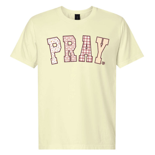 Texas A&M Aggies light yellow t shirt with PRAY patterned letters and small ATM logo