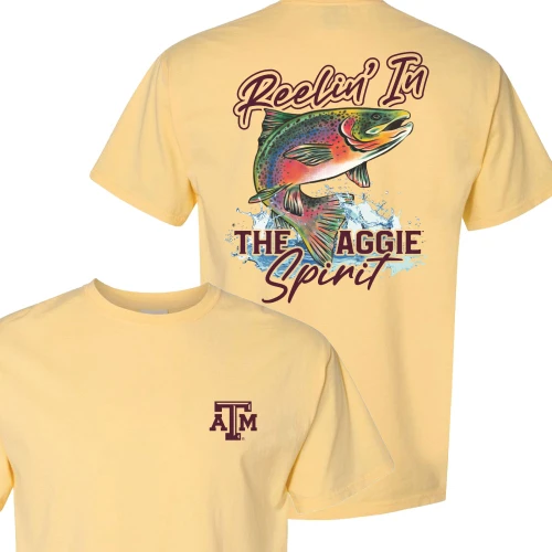 Light yellow Texas A&M t shirt with small ATM logo on front and large back graphic of colorful fish jumping with “Reelin’ in the Aggie Spirit” text