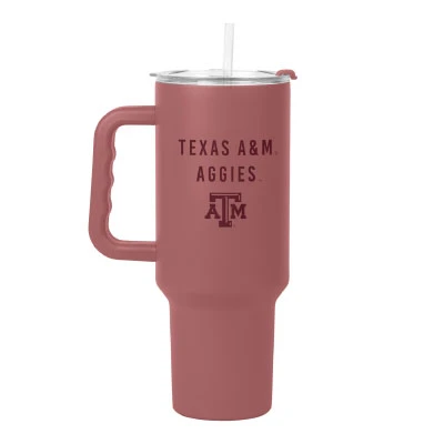Dusty rose Texas A&M 40-ounce tumbler featuring maroon Texas A&M Aggies lettering and logo, a large comfort-grip handle, clear lid, straw, and tapered base.