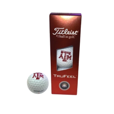 Three-pack of Titleist TruFeel white golf balls featuring maroon Texas A&M logos, shown with coordinating Titleist packaging for Aggie golfers and Texas A&M fans.