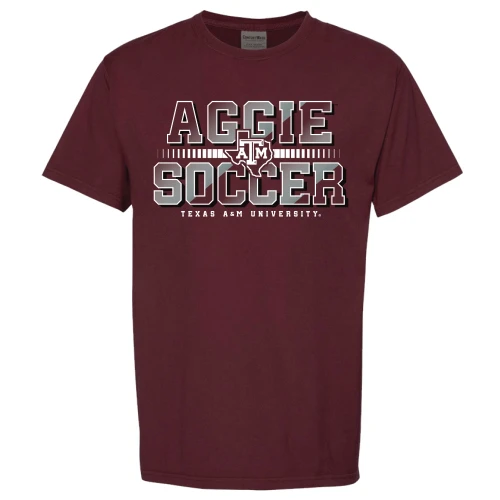 Maroon Texas A&M Aggies soccer t shirt with “Aggie Soccer” text, ATM logo, and Texas A&M University lettering across the front