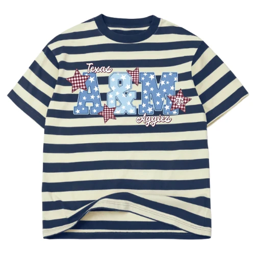 Navy and cream striped Texas A&M t shirt featuring large patriotic “A&M” lettering filled with blue star patterns, red gingham stars with small ATM logos, and “Texas Aggies” script across the front of the shirt