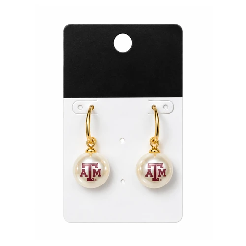 Texas A&M earrings featuring polished gold-tone hoops with round ivory pearl-inspired drops, each decorated with a maroon A&M logo for an elegant Aggie accessory.