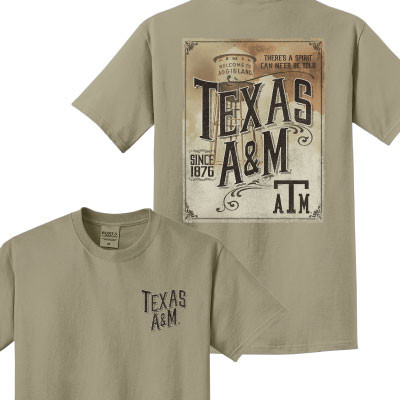 Sand-colored Texas A&M T-shirt featuring a small front chest graphic and a vintage poster-style back design with classic typography and the iconic Texas A&M water tower in the background.