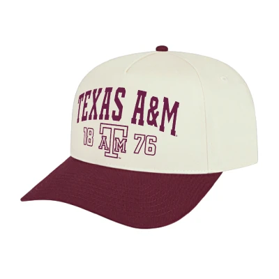 Cream and maroon Texas A&M cap featuring arched Texas A&M lettering, 1876 details, a vintage A&M Vault logo, matching maroon top button, and curved maroon bill.
