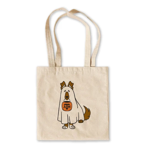 Natural canvas-style Texas A&M tote bag with long handles featuring Reveille dressed in a white ghost costume and holding an orange trick-or-treat bucket with an A&M logo.