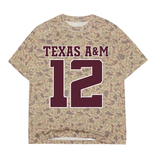 Texas A&M short-sleeve t-shirt featuring an allover tan, olive, and brown camouflage pattern with maroon Texas A&M lettering and an oversized maroon number 12 outlined in white.