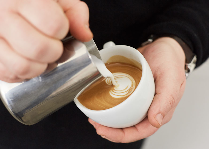 Pouring a Dot to begin a tulip latte art design