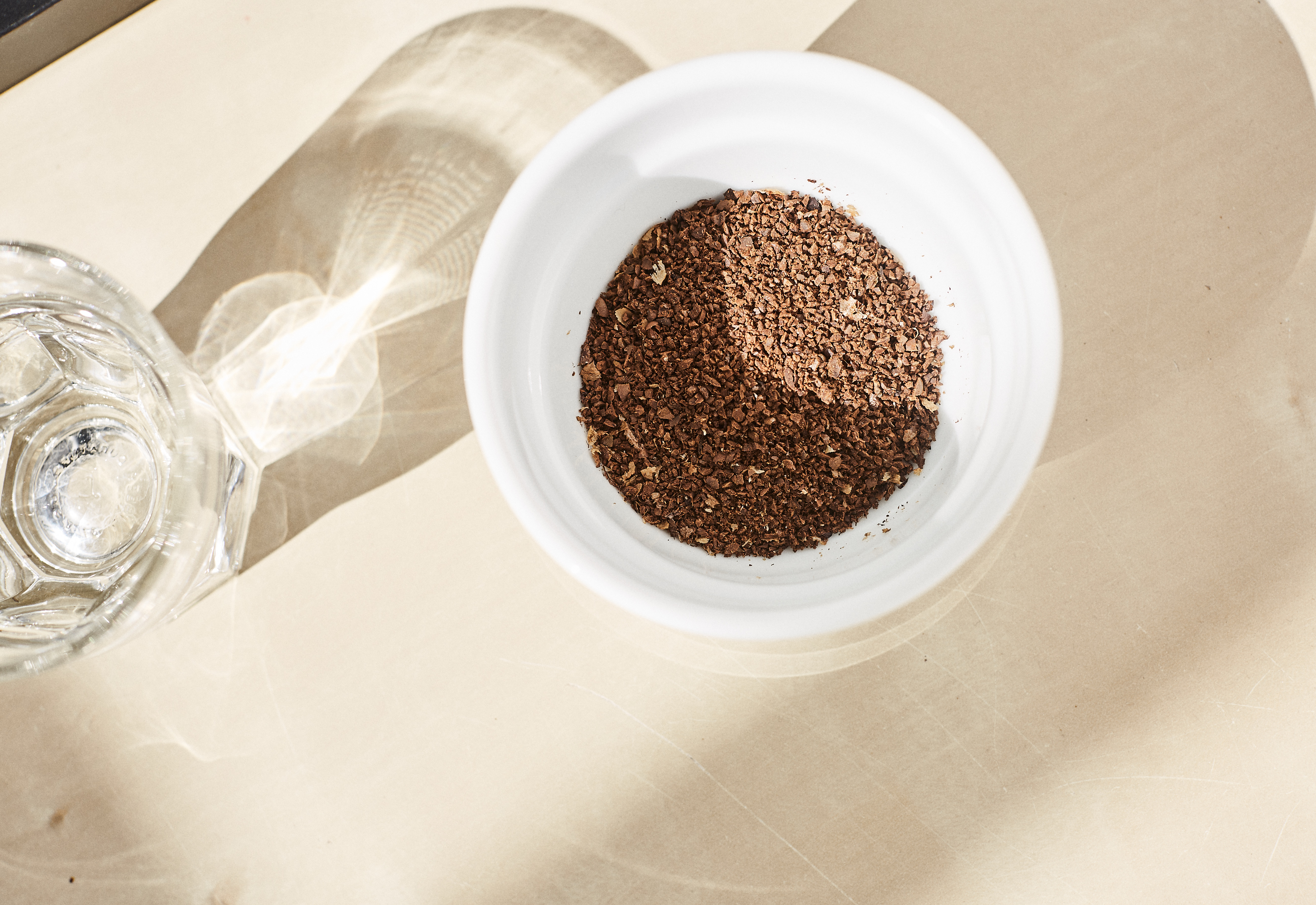 coffee grounds in cupping bowl with gibraltar