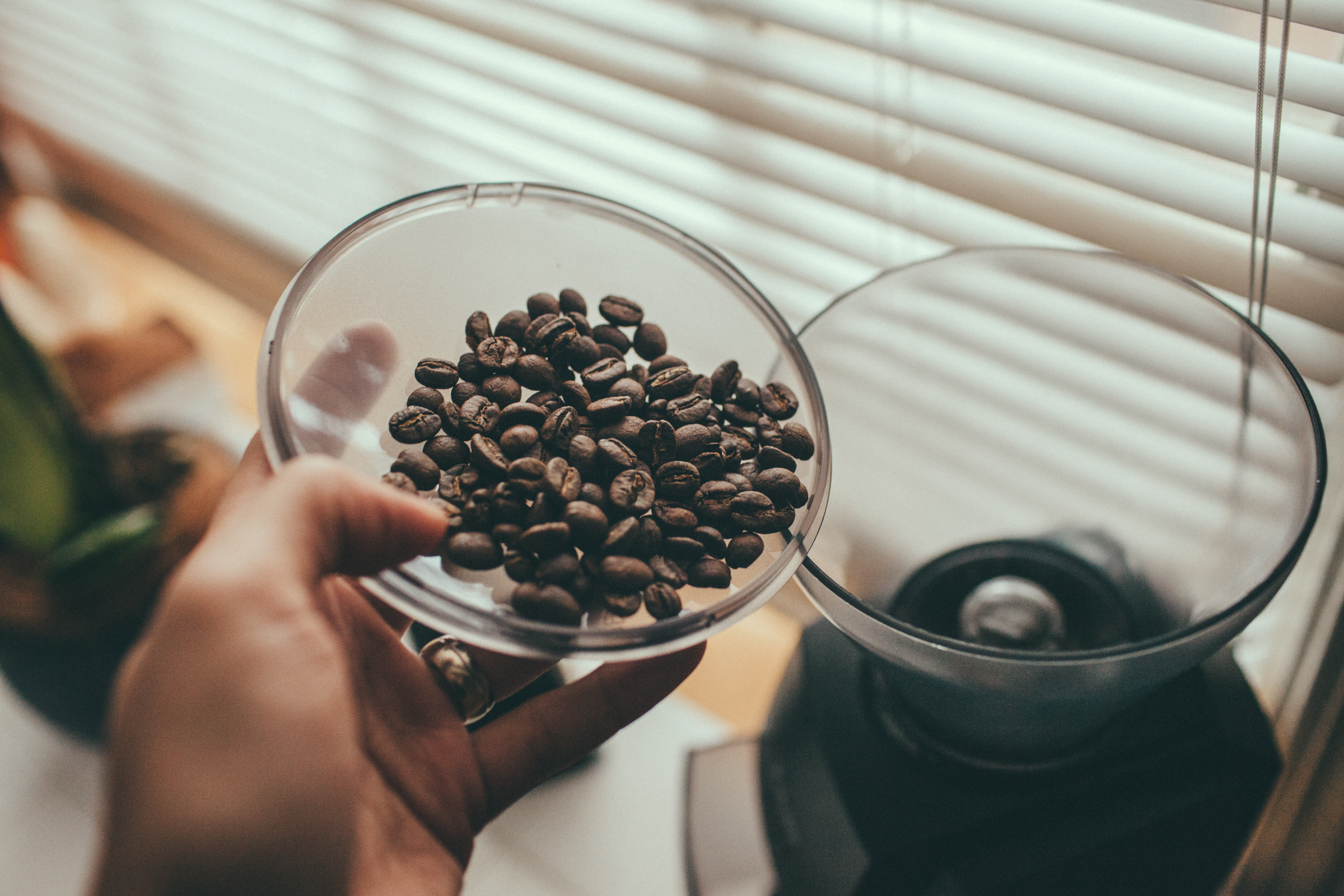 Dosing coffee into a burr grinder A good burr grinder is essential to making great coffee at home