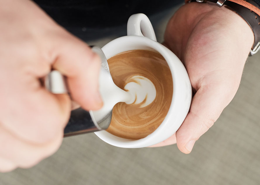 Pouring a small dot in a white cup