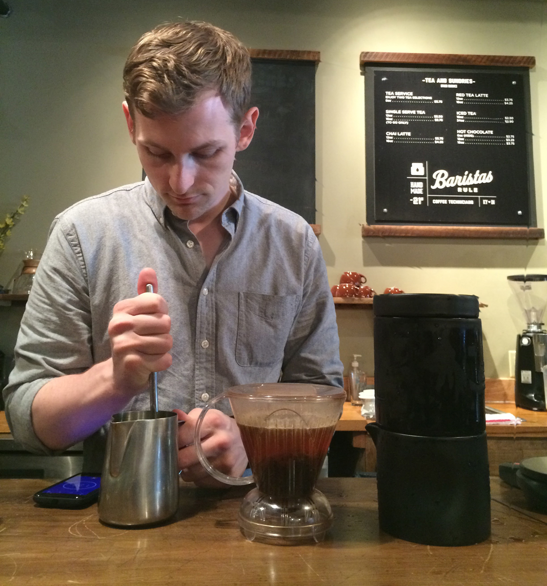 Picture of a man making tea to chill in the Coil.