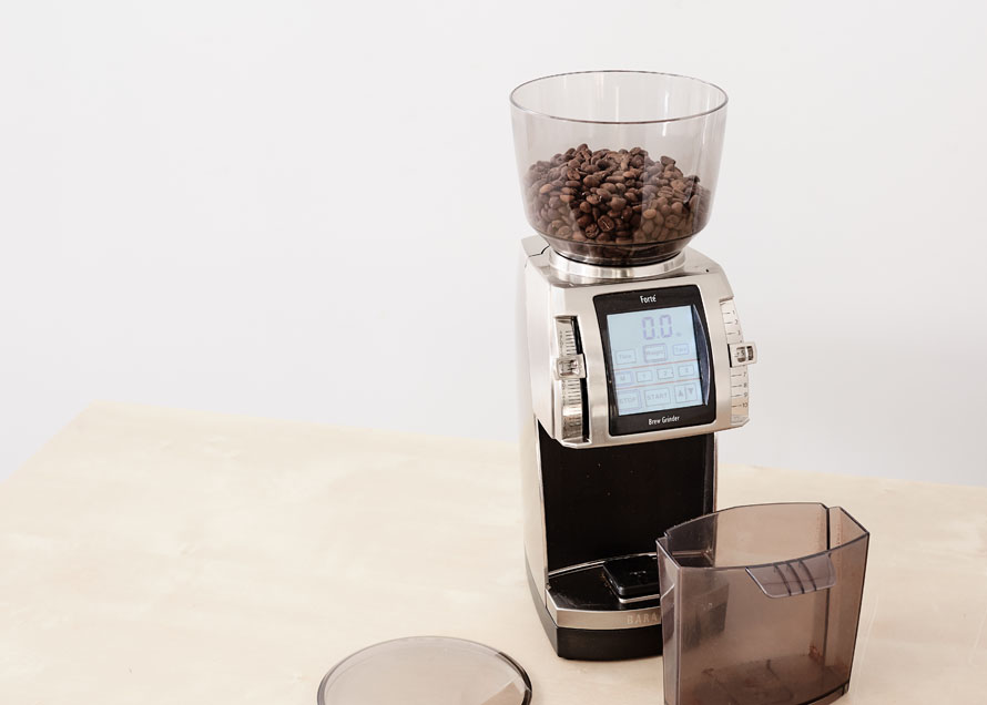 Forte grinder with coffee in the hopper, lid off, grounds bin removed