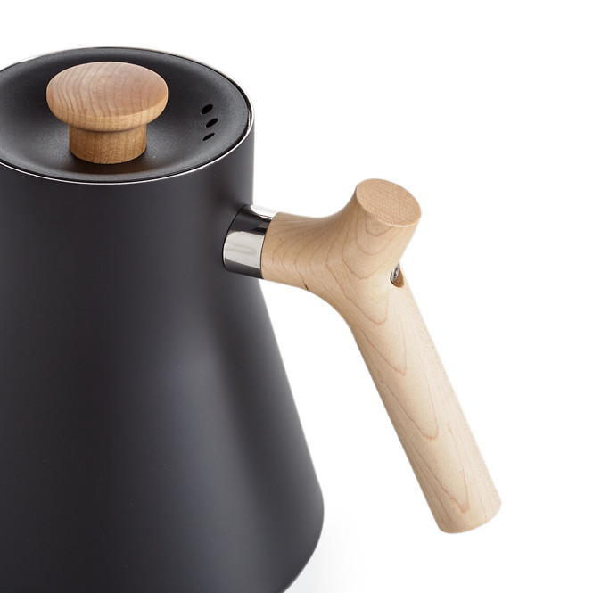 Fellow Stagg EKG Pouring Kettle in black, focused on the maple handle