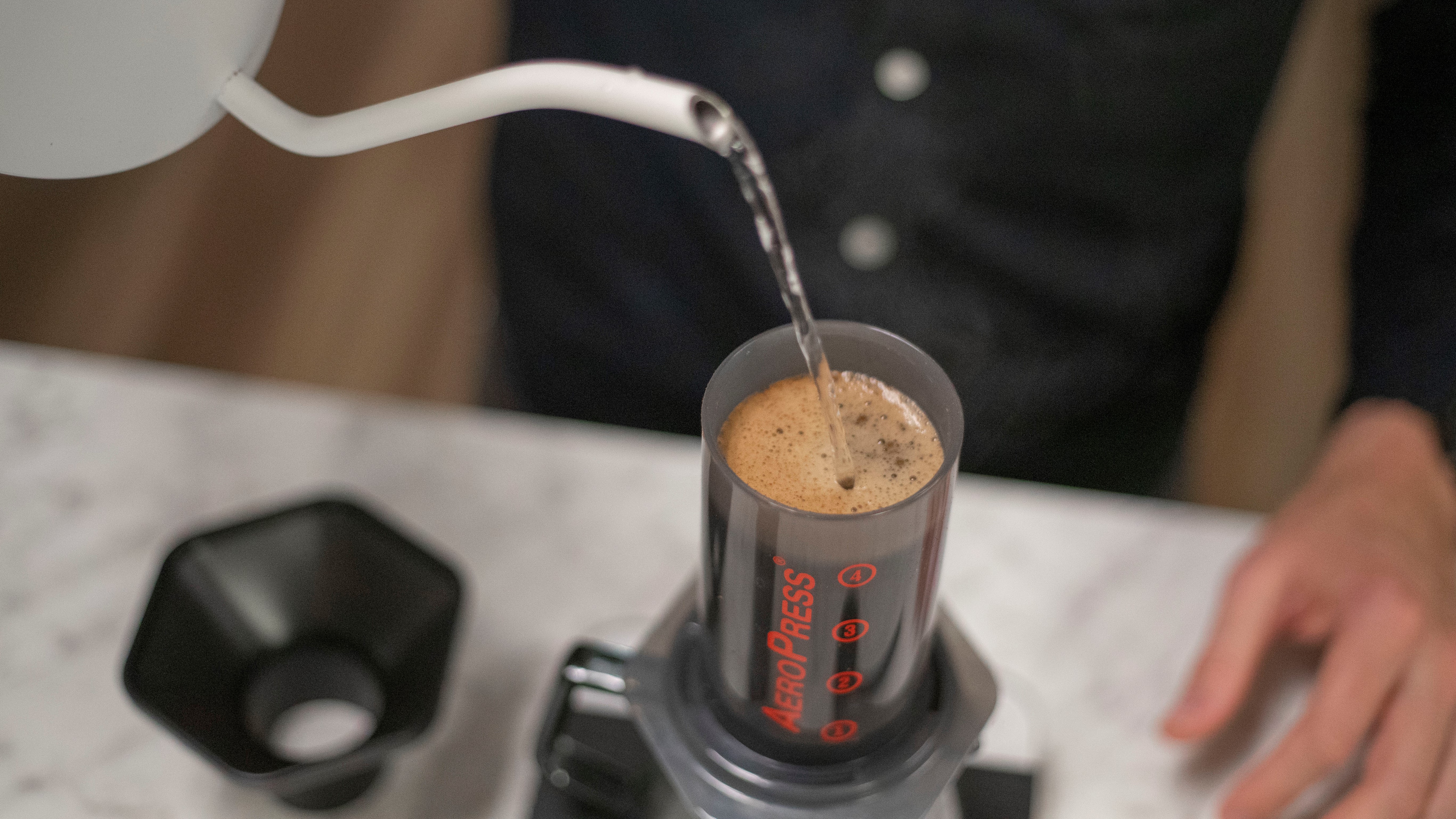 Pouring water into an AeroPress