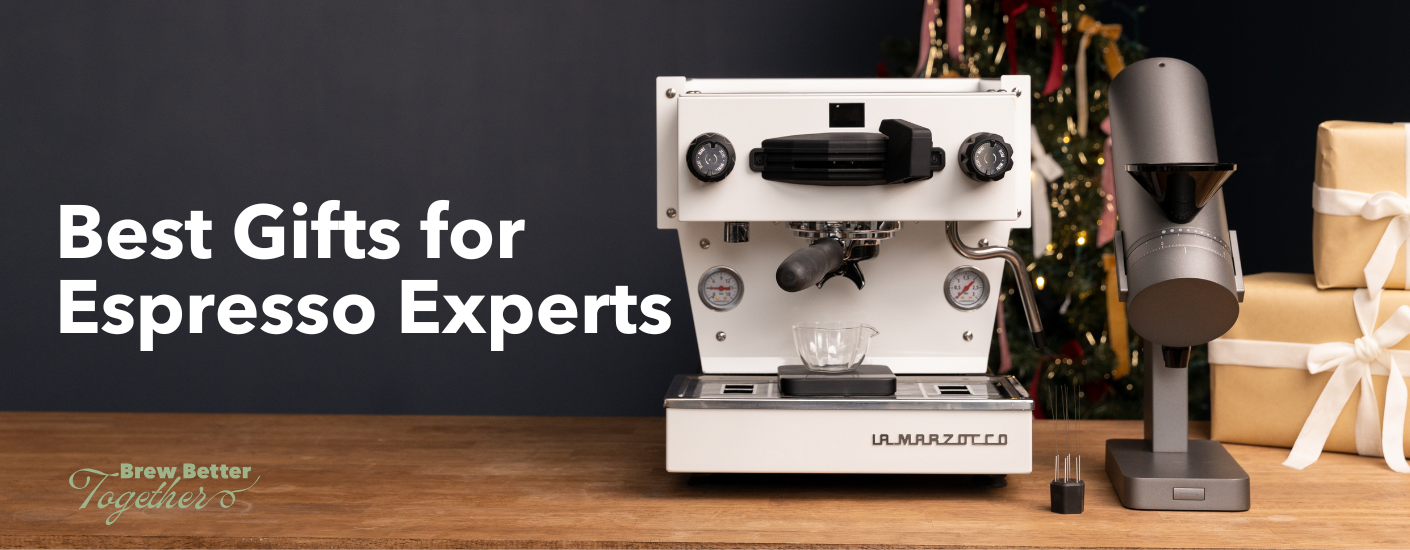 A La Marzocco Linea mini, WDT tool and Acaia grinder sitting on a holiday themed table.