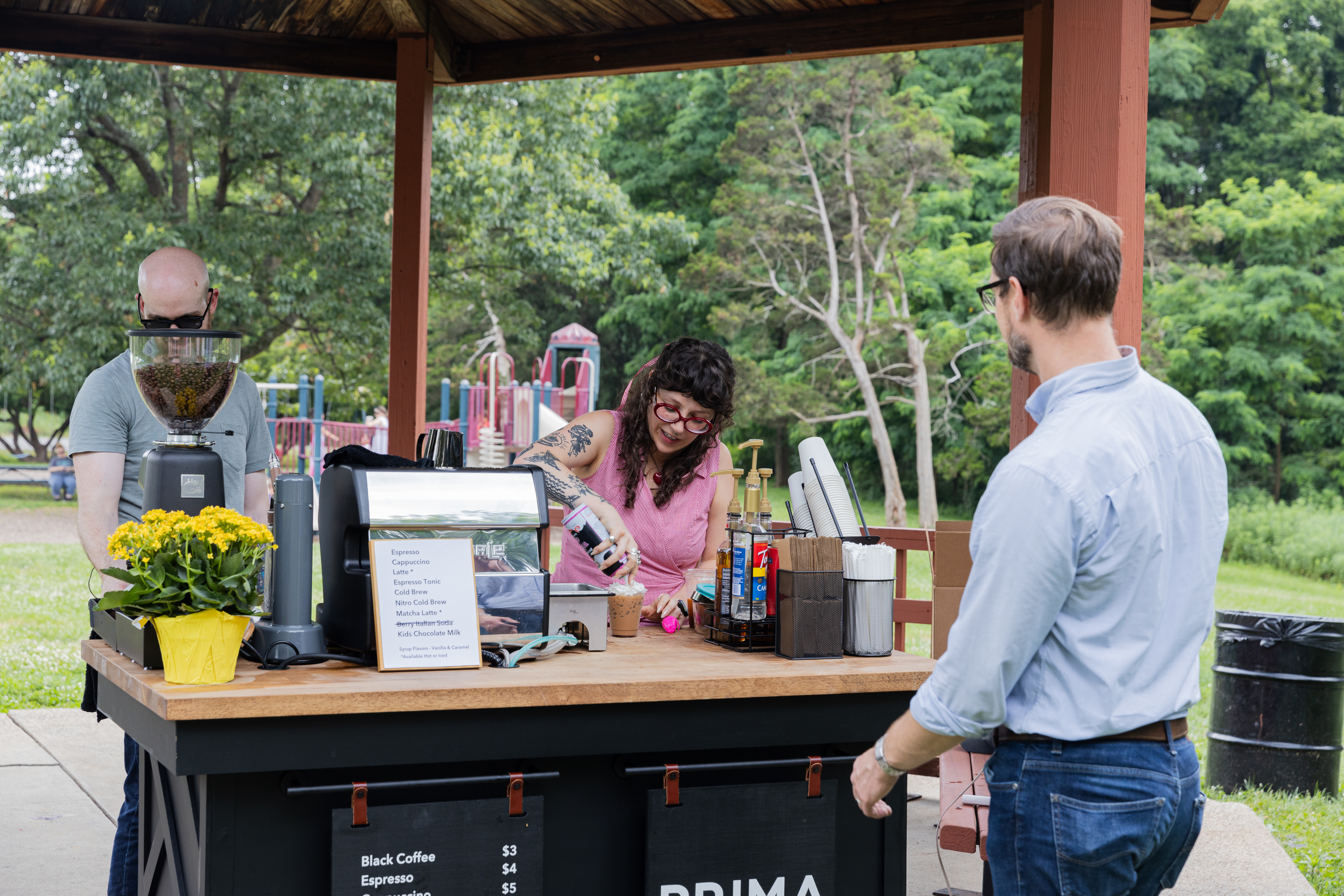 Serving a cold chocolate milk from a coffee cart