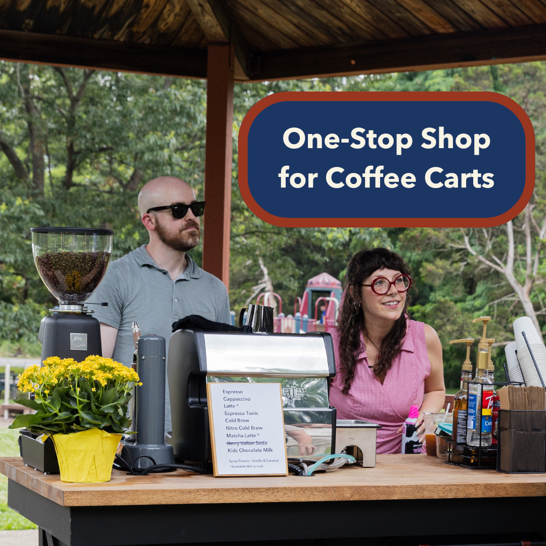 Man and woman smiling at a customer behind a coffee cart at a park and text on the photo that says One-Stop Shop for Coffee Carts