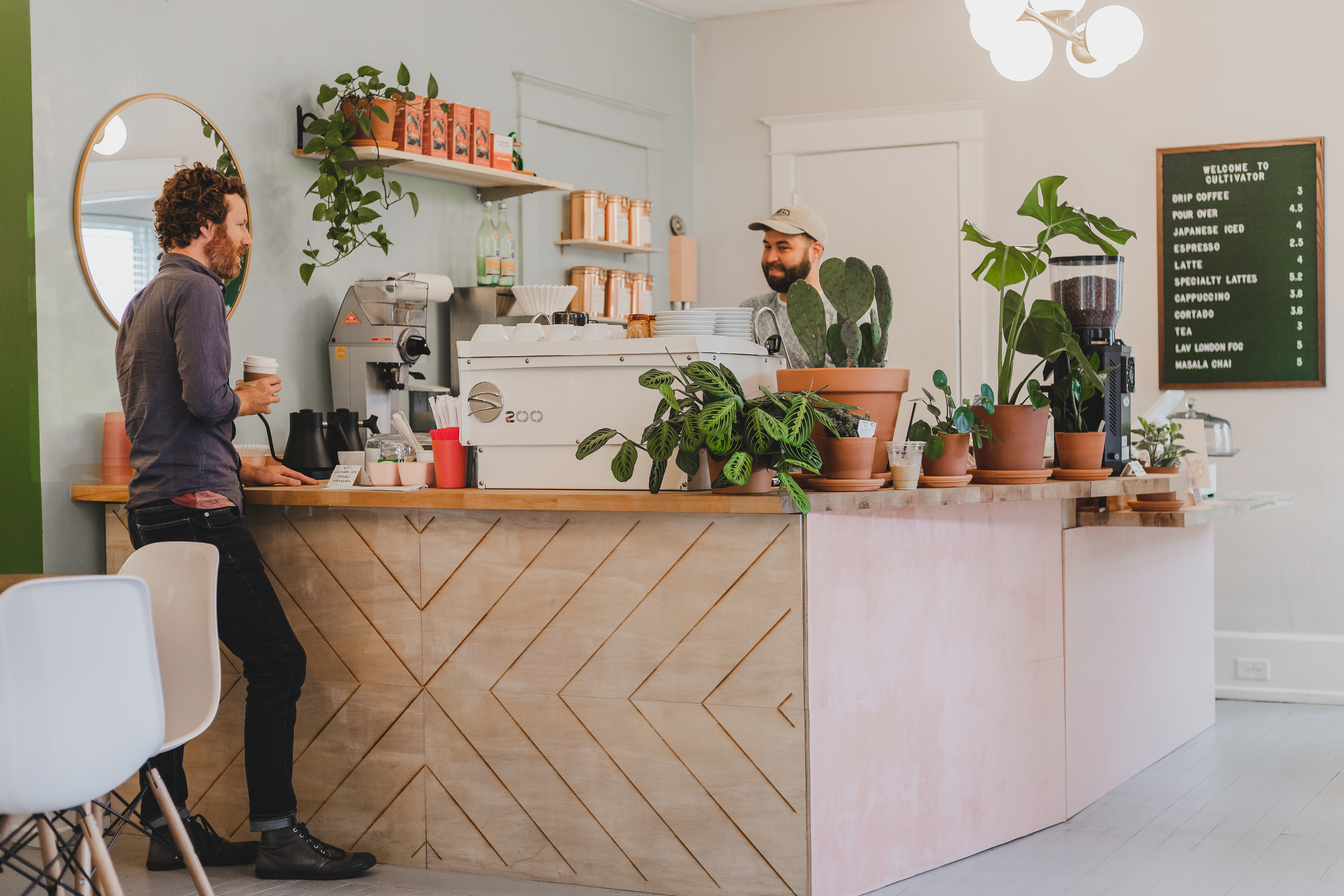 A barista talking to a customer