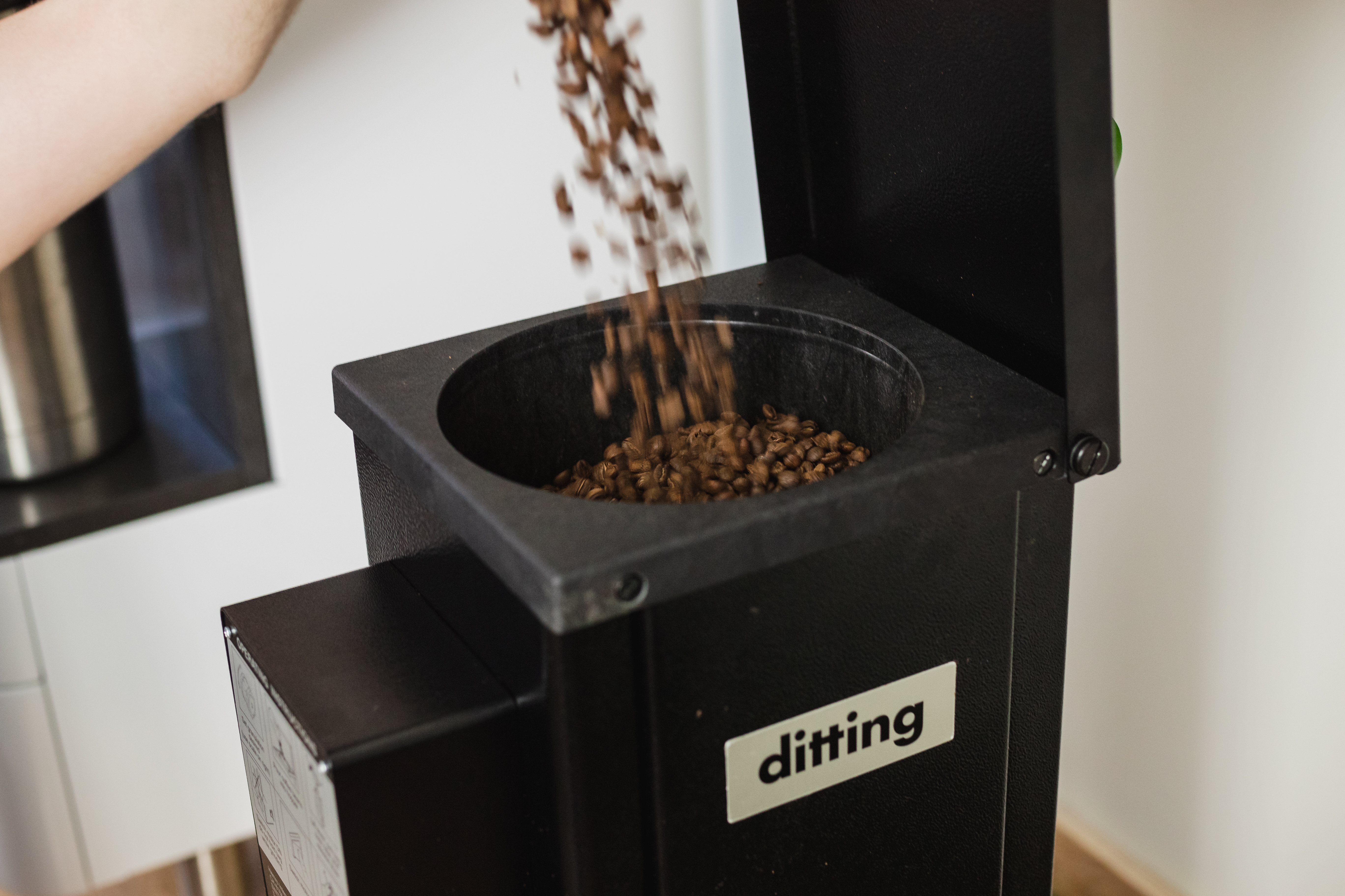 Pouring Coffee Into the Hopper
