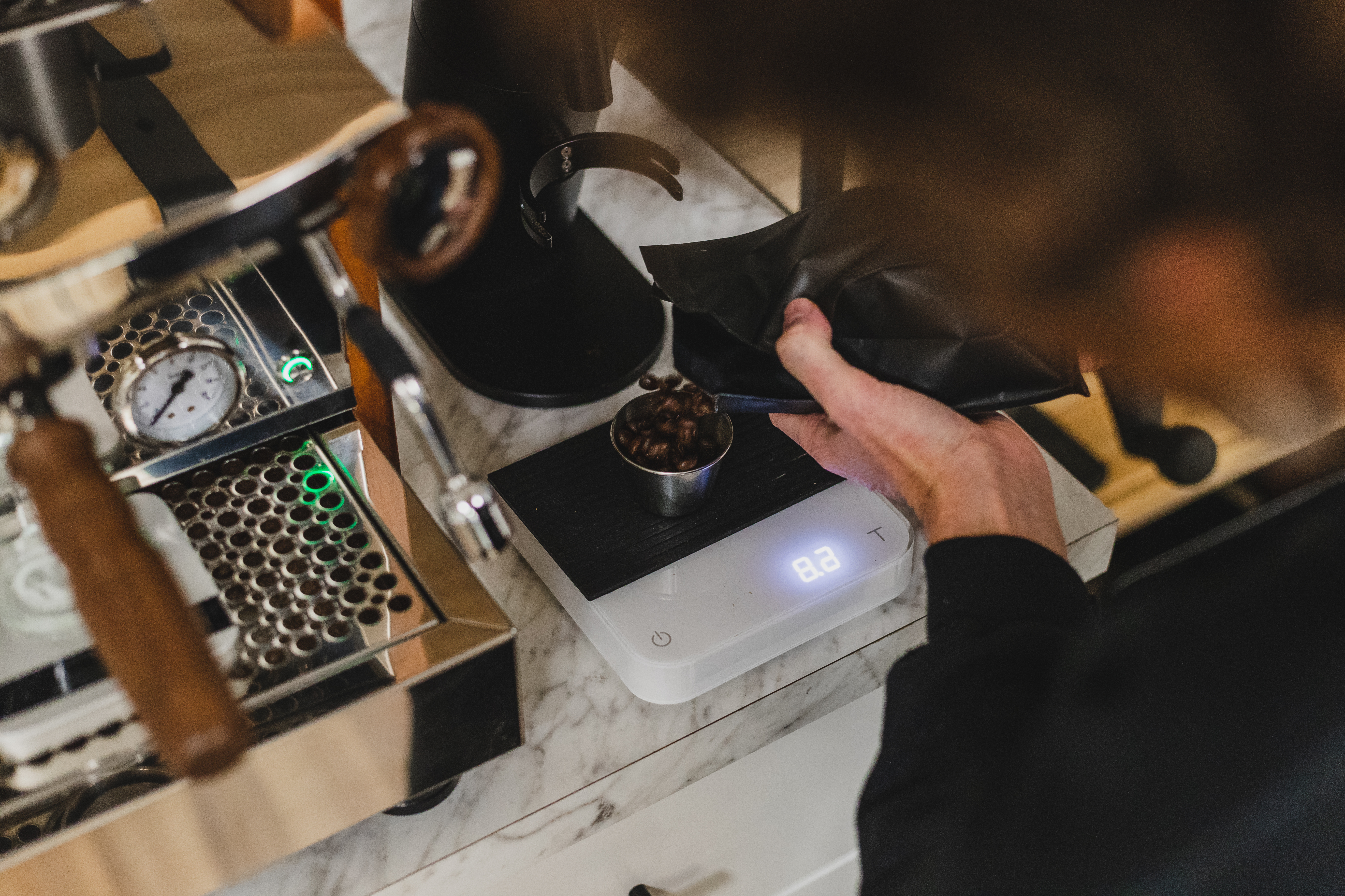 Weighing an espresso dose on an Acaia Pearl scale