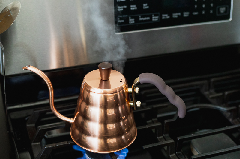 Copper kettle on gas stove