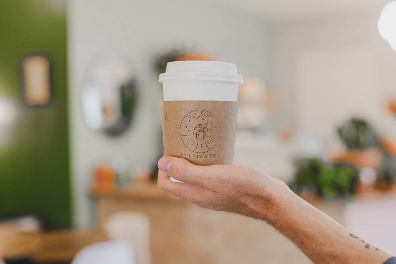 Disposable coffee up with logoed sleeve