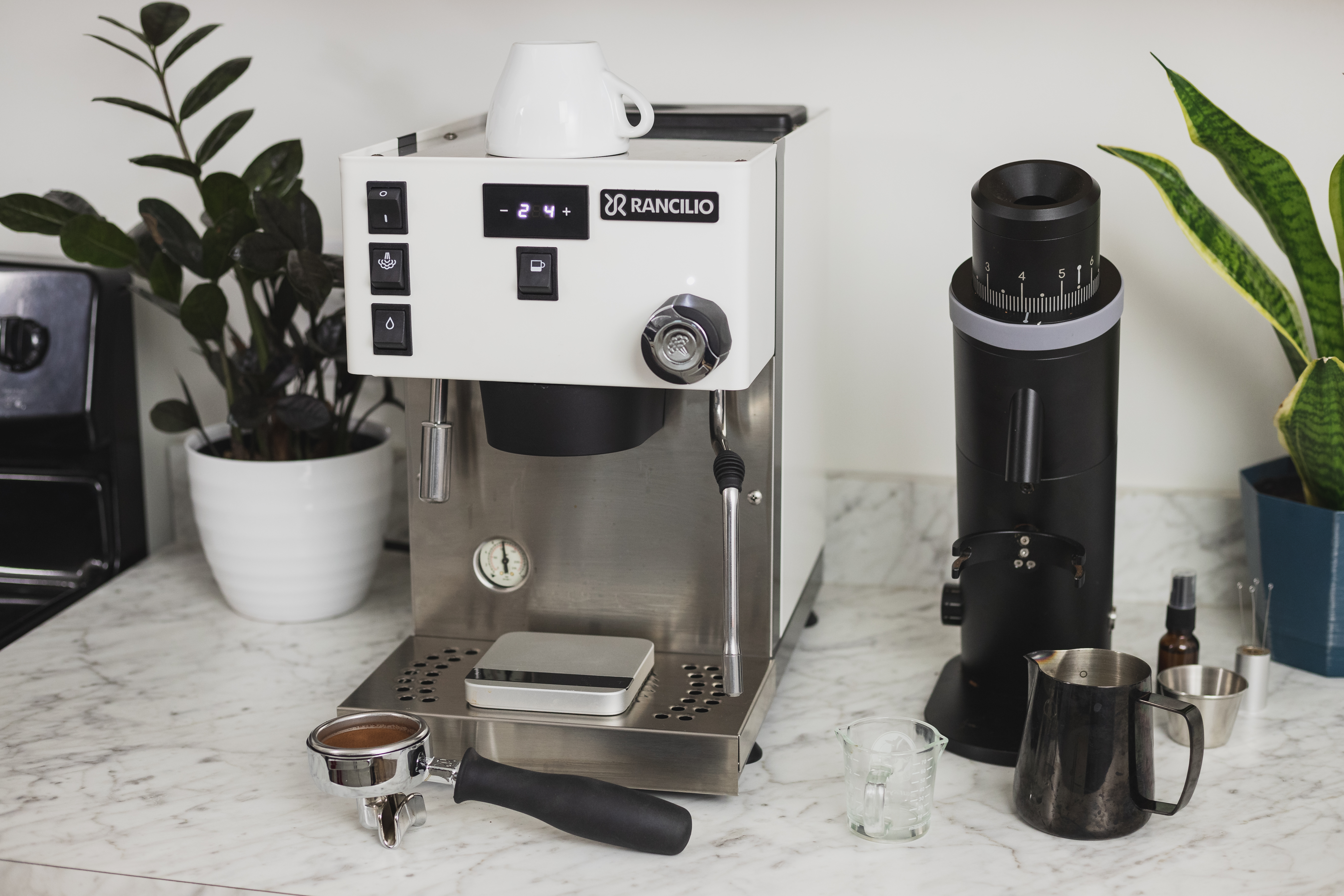 A Barista Using The Flair Espresso Maker Is A Non-electric Coffee Brewing  Device Using A Lever Or Handle. For Extracting Espresso On A Table With  Coffee Making Iced Coffee. Soft Focus Stock