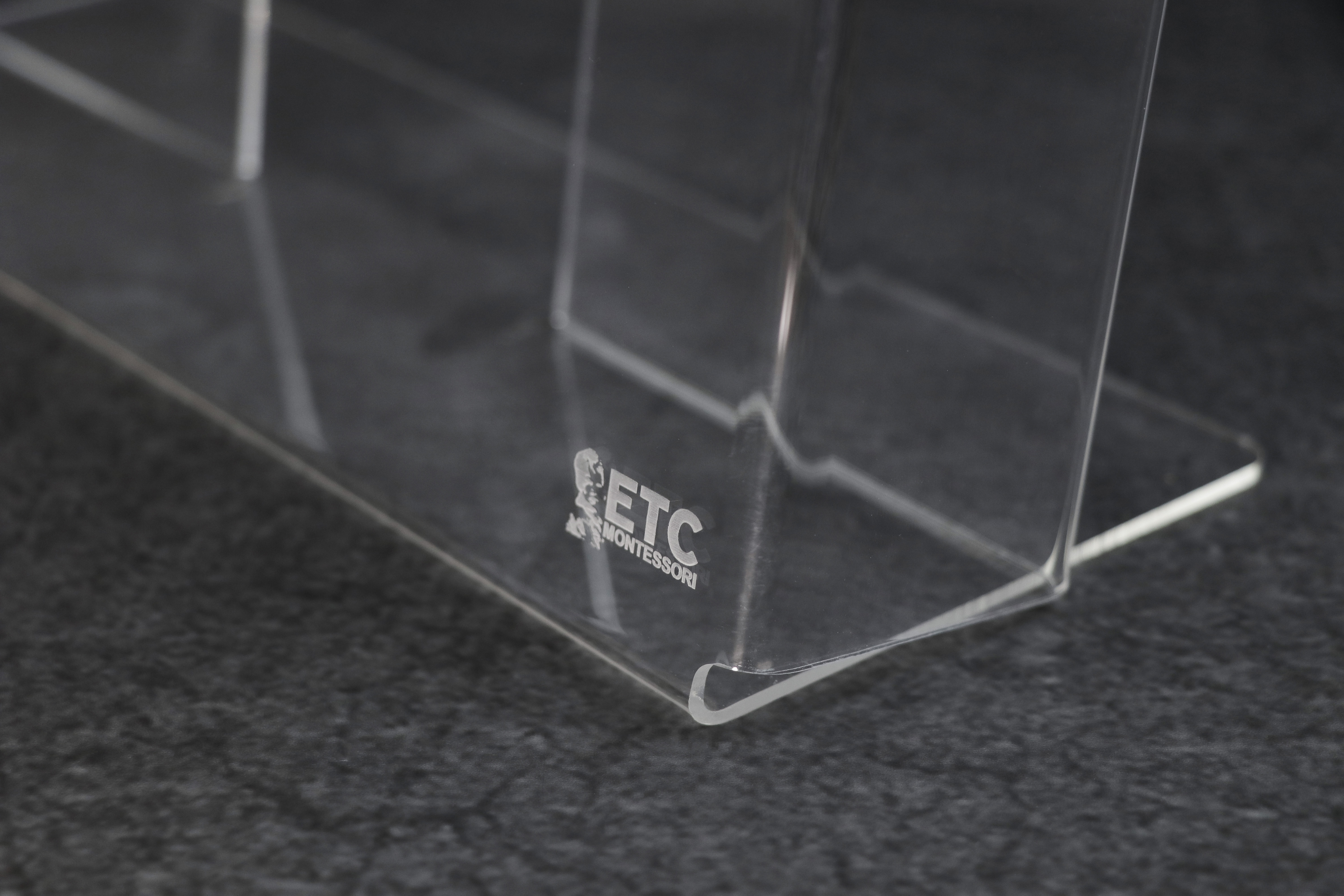 Detail of an ETC Montessori acrylic container used for holding Montessori task cards