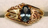 Montana sapphire Black Hills Gold ring leaves on each side.