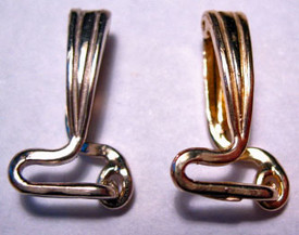 Hinged omega converter bail