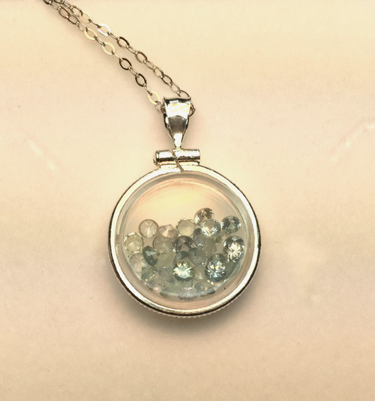 Montana Sapphire Locket Pendant with Faceted Stones Coin edge mounting Montana Sapphire Locket Pendant with Faceted Stones Coin edge mounting