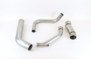 A piping kit for a Peterbilt 386 truck with a Cummins ISX CM570 engine.  The kit includes left side air to air tube, right side air to air tube, lower radiator tube and upper radiator tube.  The tubes are made from 304 stainless steel and offered in a mill finish.