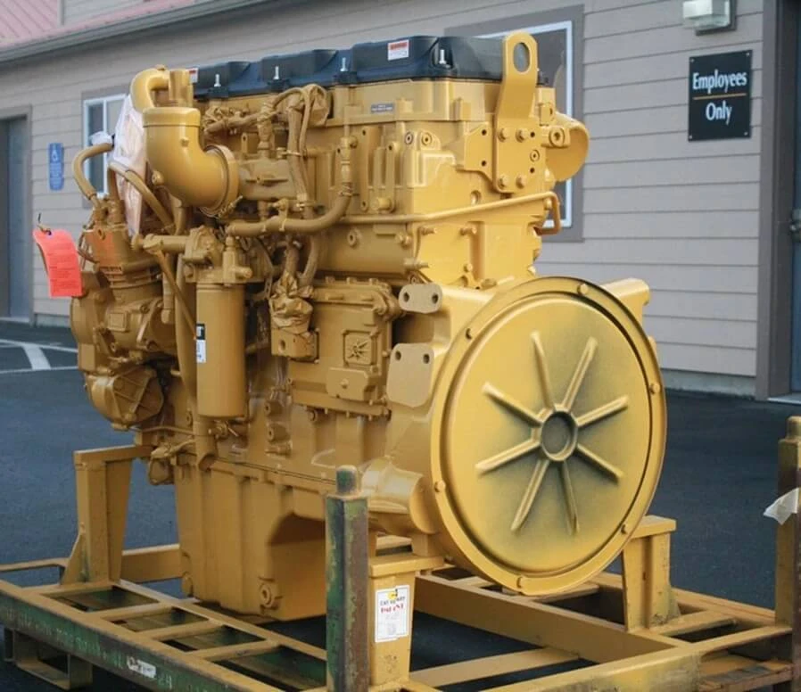 Caterpillar C13 diesel engine, side view with visible turbocharger, radiator fan, and accessory drive assembly