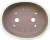 Top-down view of large beige bonsai pot with oval opening, glazed lip, and drainage holes