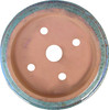 Top-down view of speckled green bonsai pot with wide opening and drainage holes