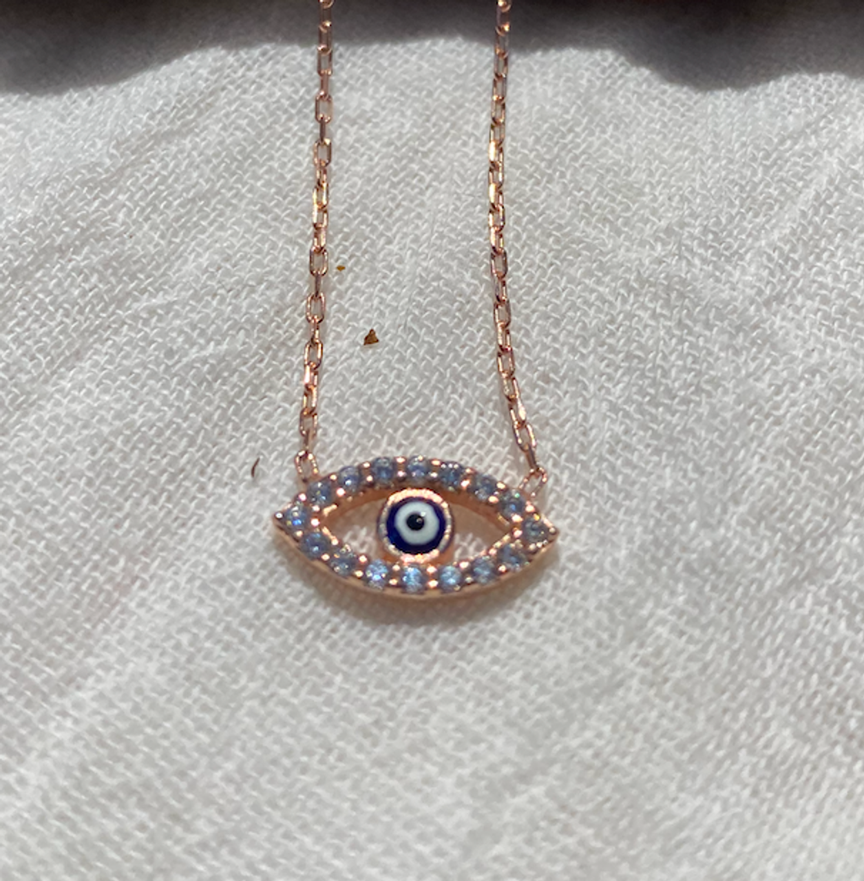 Lab-Created Blue Sapphire and 1/15 CT. T.W. Diamond Evil Eye Necklace in  Sterling Silver | Zales