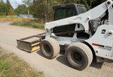 Smoothing out the driveway quickly and efficiently.