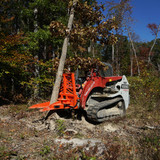 Eterra Skid Steer Riptide pulling a tree
