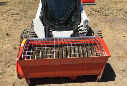 Mixing concrete with the Mix & Go 250 skid steer concrete mixer.