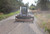 Grading a driveway with the skid steer box grader attachment.