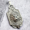 King Leonidas pendant on a slab of concrete