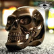 big bold and heavy bronze colored steel skull ring