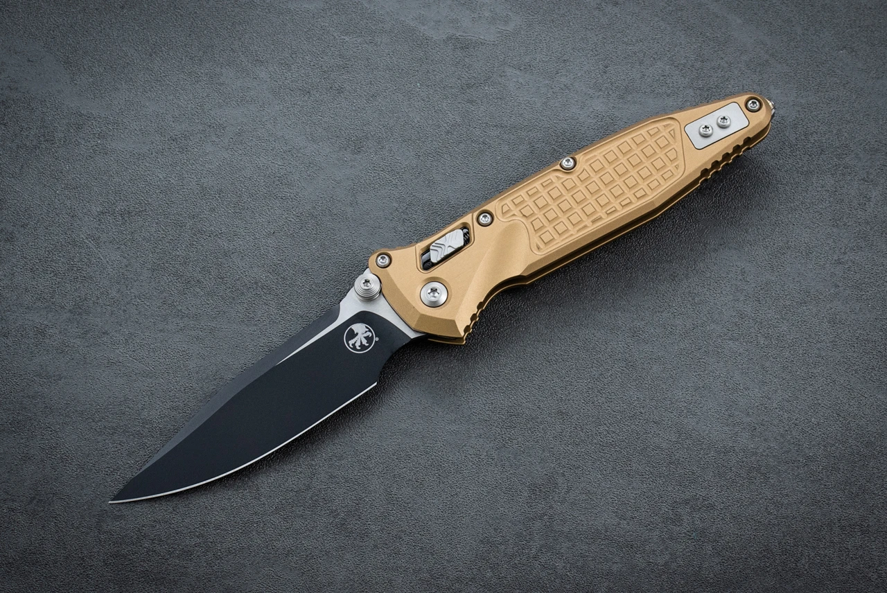 Microtech Knives Socom RAM-LOK S/E Manual Knife Clip Point 2-Tone Black Blade w/ Tan Frag Aluminum Handles - 160RL-1FRTA