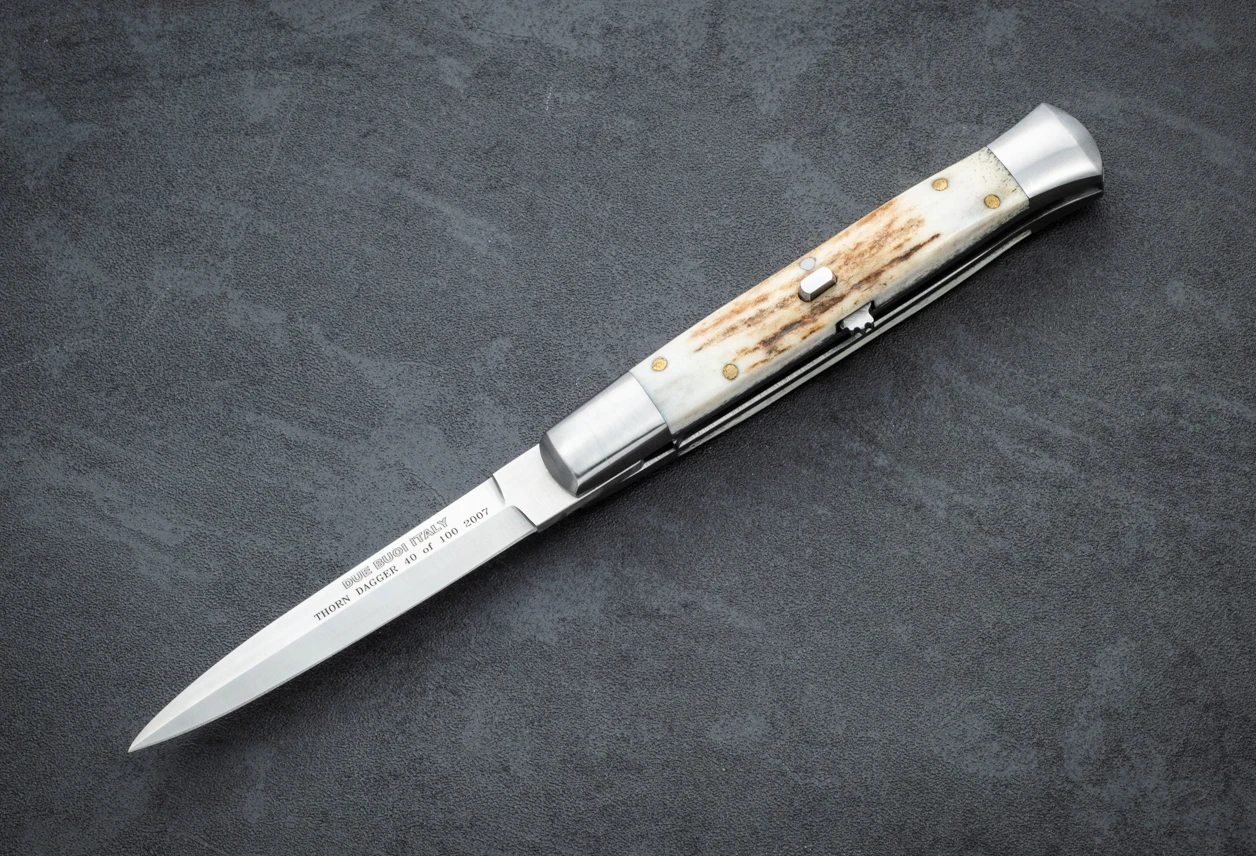 Due Buoi Italy Thorn 40 of 100 Stiletto Automatic Dagger Knife Satin Blade w/ Stag Horn Handle