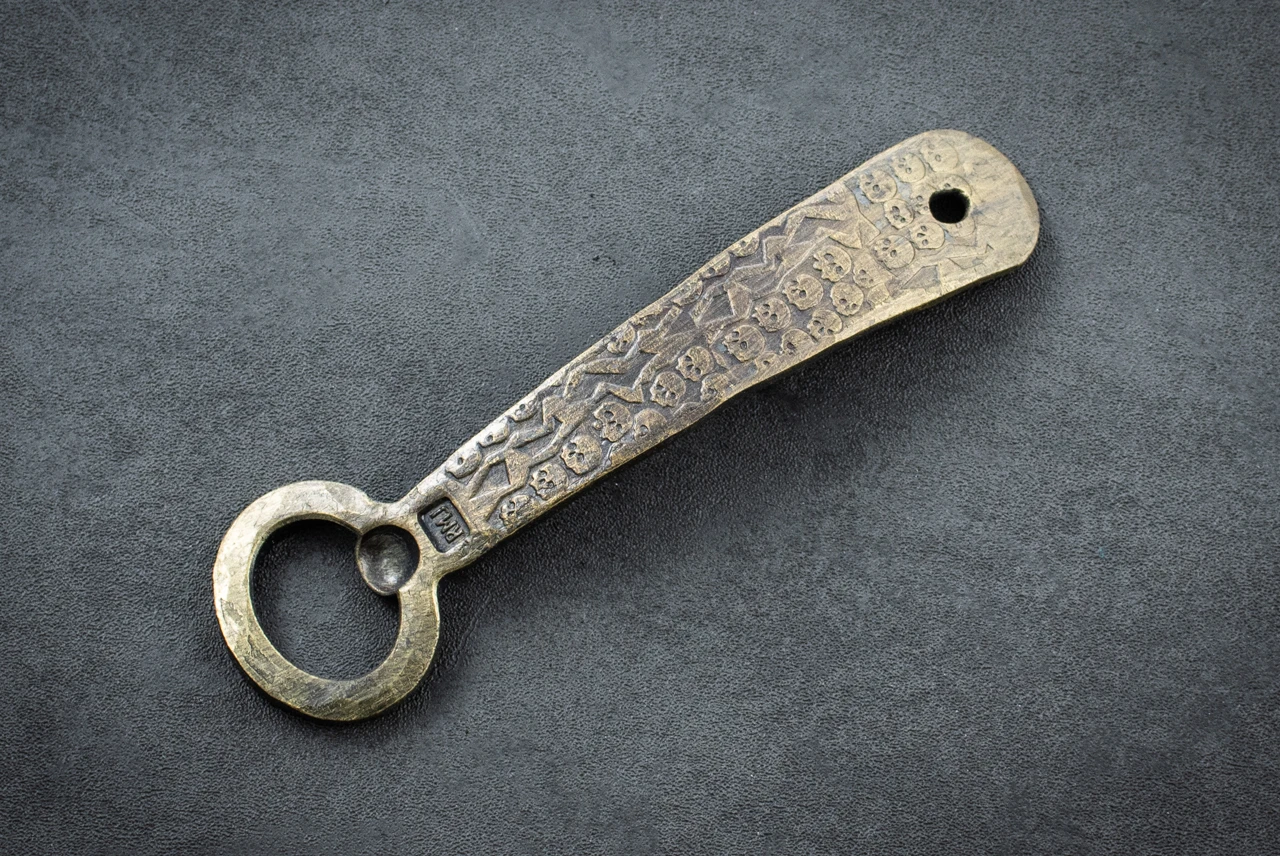 RMJ Tactical Gold Point Forge Bottle Opener Catacomb of Skulls Theme